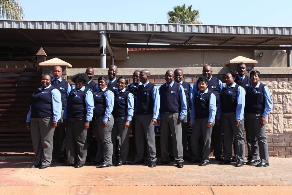 The guarding services team standing in front of Ligit Security Solutions building